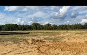 Aerial view of a cleared dirt lot ready for development