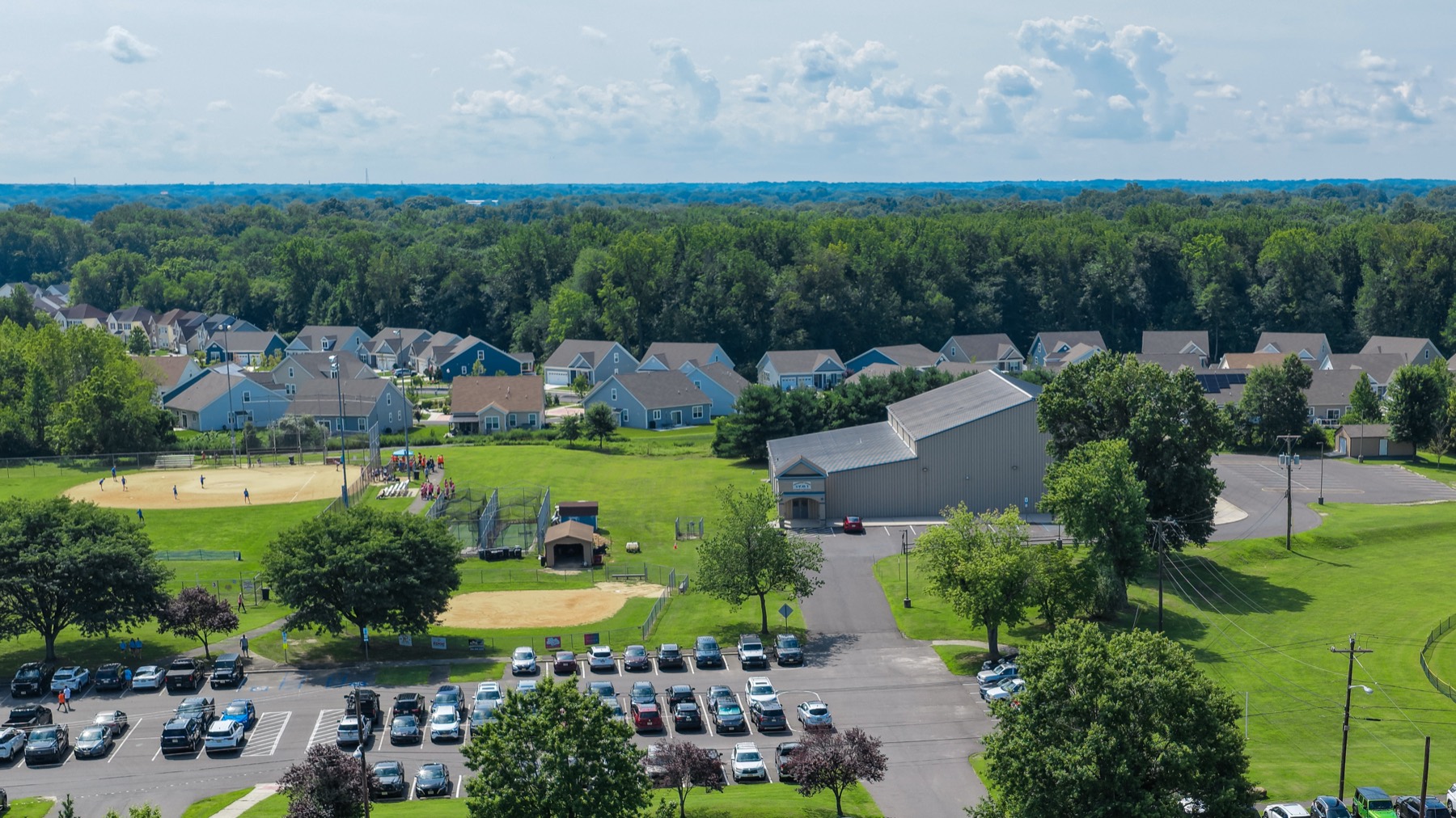 Aerial view of a residential neighborhood next to ballfields
